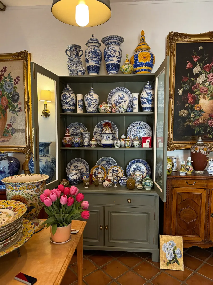 Painted cabinet filled with blue-and-white porcelain