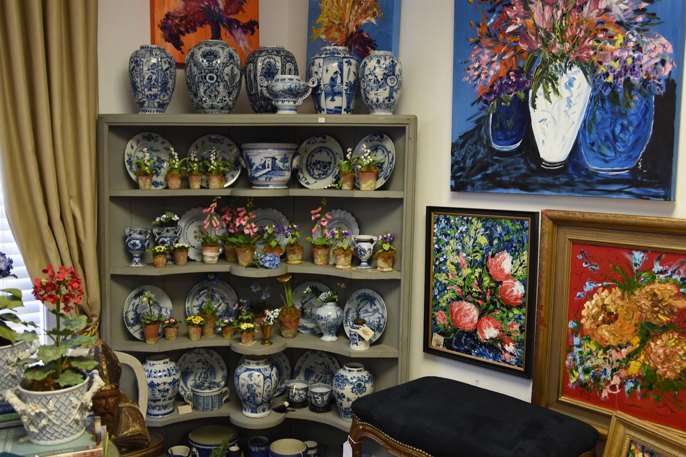 Corner cabinet filled with blue and white porcelain
