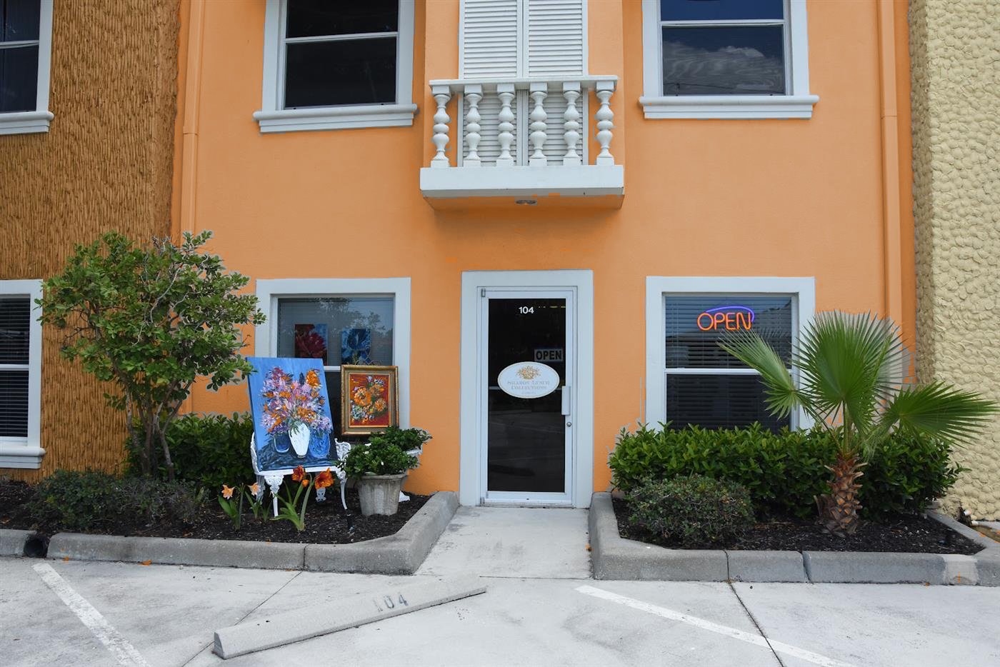 The sherbet-orange storefront at 6240 Shirley St, Suite 104